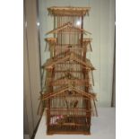 A BAMBOO PAGODA STYLE NOVELTY BIRDCASE, with six fabric birds, height approximately 97cm