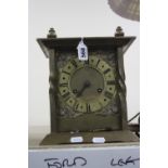 A BRASS CASED MANTEL CLOCK, approximate height 26cm