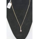 A MODERN 9CT GOLD RUBY AND DIAMOND PENDANT, one pear shape ruby measuring approximately 6.88mm x