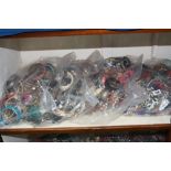 FOUR BAGS OF COSTUME JEWELLERY