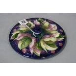 A MOORCROFT POTTERY LID, Leaf and Berry pattern on blue ground, paper label, impressed and signature