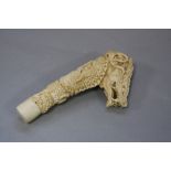 A FINE ANTLER CARVING OF A DRAGON, in the form of a walking stick handle, approximate height 15cm