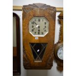 A FRENCH WALNUT WALL CLOCK (winding key)