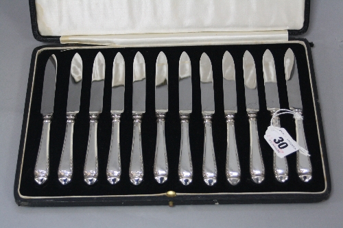 A CASED SET OF TWELVE GEORGE V SILVER HANDLED FRUIT KNIVES, maker John Biggin, Sheffield 1927