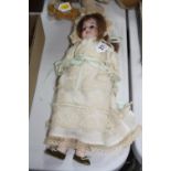 AN ARMAND MARSEILLE BISQUE HEAD DOLL, nape of neck marked 'A.M.D.E.P. 2/0' with a date obscured by