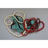 VARIOUS STRINGS OF STONE BEAD NECKLACES, including red coral