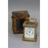 A 20TH CENTURY CARRIAGE CLOCK, enamel dial, Roman numerals, retailed by Z. Barraclough & Son Ltd,