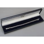 A 9CT WHITE GOLD TENNIS BRACELET, approximate length 19cm, approximate weight 10.3 grams