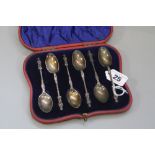 A CASED SET OF SIX LATE VICTORIAN SILVER APOSTLE TOP TEASPOONS, maker William Hutton & Sons Ltd,