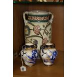 A PAIR OF ROYAL DOULTON TWIN HANDLED VASES, decorated with blue orchid, height approximately 11cm,