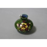 A SMALL MOORCROFT POTTERY SQUAT VASE, 'Columbine' pattern on green ground, with paper label to base,