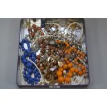 A TRAY OF COSTUME JEWELLERY, including a silver bracelet, etc
