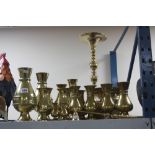 A COLLECTION OF BRASSWARE, including two candlesnuffers, vases, planter, etc