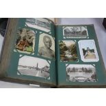 A VERY LARGE COLLECTION OF POSTCARDS, dating from the late 19th/early 20th Century, in an album,