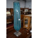A METAL FRAMED VASE, with blue pressed glass, approximate height 66cm