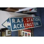 AN ENAMEL SIGN, 'R.A.F. STATION ACKLINGTON', shaped as an arrow pointing left, approximately 25.