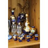 A BOHEMIAN BLUE GLASS LIQUEUR SET, together with similar glassware including a pair of lustres, s.