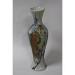 A MOORCROFT TRIAL VASE, of baluster form with three vertical fish breaking the surface of the water,