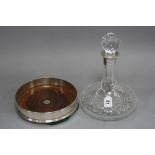 A MODERN SILVER DECANTER COASTER, plain exterior, mahogany inset base, maker J.A. Campbell, London