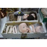 A QUANTITY OF CREATIONS PAST AND OTHER REPRODUCTION DOLL PARTS, heads, limbs, wigs, etc (two boxes)