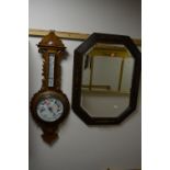 AN OAK FRAMED WALL MIRROR, and an oak cased aneroid barometer (sd, glass broken) (2)