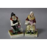 A PAIR OF 19TH CENTURY STAFFORDSHIRE FIGURES, 'Jobson' and 'Nell' (2)
