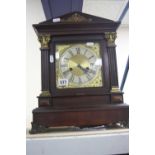 AN EARLY 20TH CENTURY WALNUT STAINED BRACKET CLOCK, architectural form, Roman numerals, gong