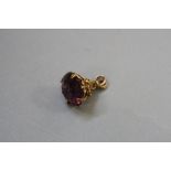 A MID 20TH CENTURY 9CT GOLD AMETHYST FOB, round circular faceted amethyst measuring approximately