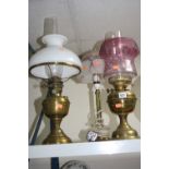 TWO BRASS OIL LAMPS, with glass shades and a table lamp (3)