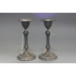 A PAIR OF 20TH CENTURY EGYPTIAN WHITE METAL CANDLESTICKS, circular sconces, knopped stems,