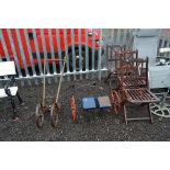 A VINTAGE METAL FRAMED CULIVATOR, marked Planet Jnr and a vintage seed drill (2)