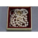 TWO PEARL NECKLACES, on 9ct clasps