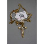 A 9CT CRUCIFIX ON A 9CT CHAIN, approximate weight 10.9 grams