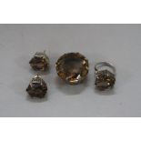 A SUITE OF SILVER AND SMOKY QUARTZ JEWELLERY, including ring, size K, pendant and a pair of