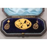 A VICTORIAN FLORAL BROOCH, together with a pair of drop earrings