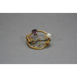 AN EDWARDIAN 9CT AMETHYST AND PEARL BROOCH