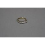 A LATE 20TH CENTURY 9CT GOLD DIAMOND FIVE STONE HALF HOOP RING, estimated total modern round