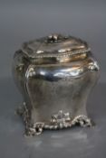 A GEORGE II SILVER TEA CADDY, of bombe outline, the pull off cover with bird finial and gadrooned