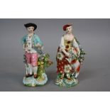 A PAIR OF DERBY PORCELAIN FIGURES OF A LADY AND GENTLEMAN, circa 1770, she dressed in yellow and