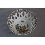 A DR WALL PERIOD WORCESTER PORCELAIN LATTICE WORK BASKET, enamelled green interspersed flower heads,