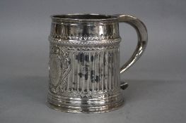 A WILLIAM III BRITANNIA STANDARD SILVER TANKARD, of cylindrical form, fluted decoration with