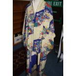 AN ART DECO PERIOD CREPE AND SILK LINED KIMONO DRESSING ROBE, printed design of cherry blossom,