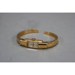 AN 18CT LADIES SINEX BANGLE WATCH, marked Courberin on reverse, approximate total weight 13.2 grams