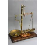 A SET OF MAW CLASS B BRASS BALANCE SCALES, with wooden drawer base and brass weights, together