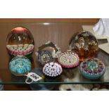 MURANO 'VETRERIA FLIOR' PAPERWEIGHT, together with six others and a bottle stopper mostly Millefiori