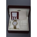 A BUECHE GIROD 9CT GENTS WATCH, boxed and papers