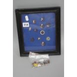 A SMALL DISPLAY CASE OF NAUTICAL ENAMEL BADGES, and eight 'Golly' badges