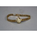 A 9CT LADIES HEFIK WATCH, on a 9ct bracelet, approximate total weight 19.3 grams