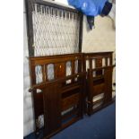 TWO EDWARDIAN WALNUT SINGLE BED FRAMES, with sprung bases