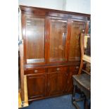 A MODERN MAHOGANY BOOKCASE, with three bevelled glass doors to the upper and three drawers and three